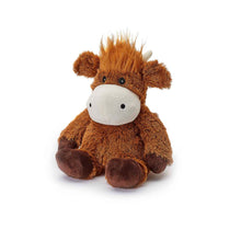 Plush toy cow with a white face on a white background